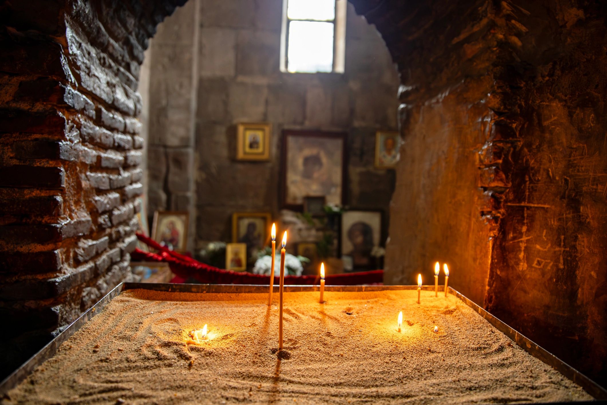 Prayer candles lit in a church