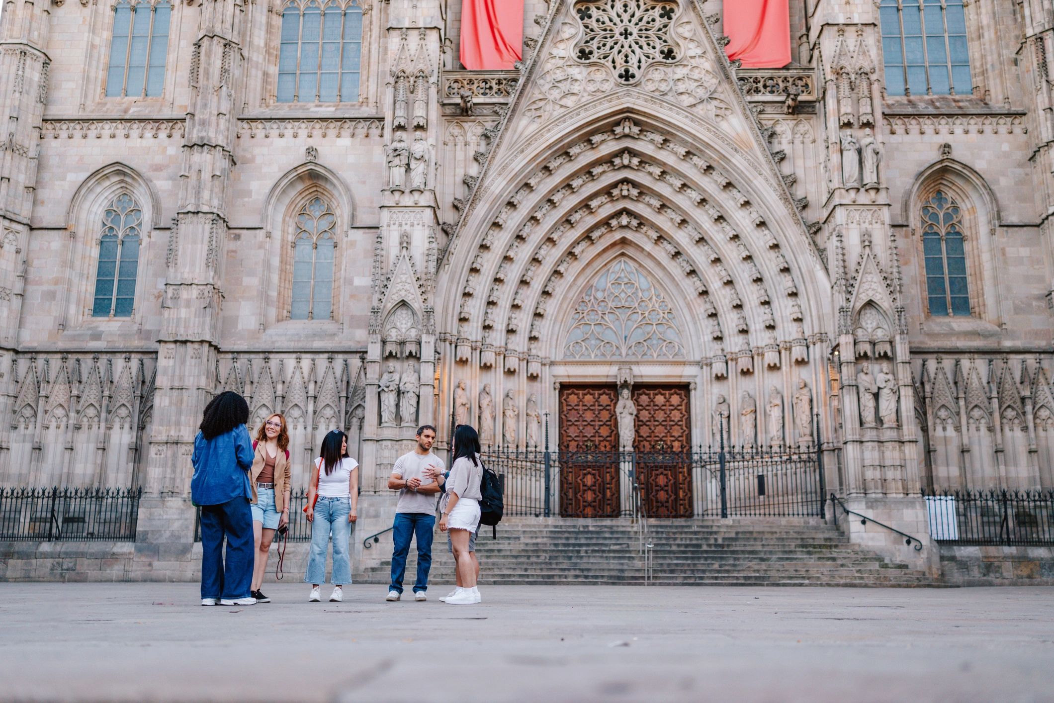 Community gathering outside a cathedral